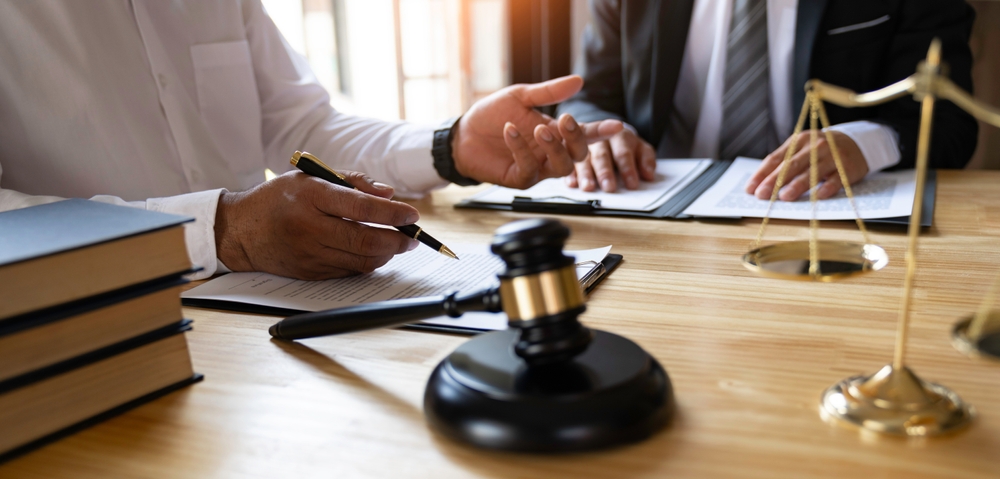Attorneys or lawyers who are reading the statute of limitations Consultation between male lawyers , tax and legal services firms.	

