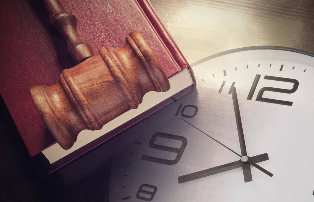 Clock, gavel and book - Concept of legal timeline