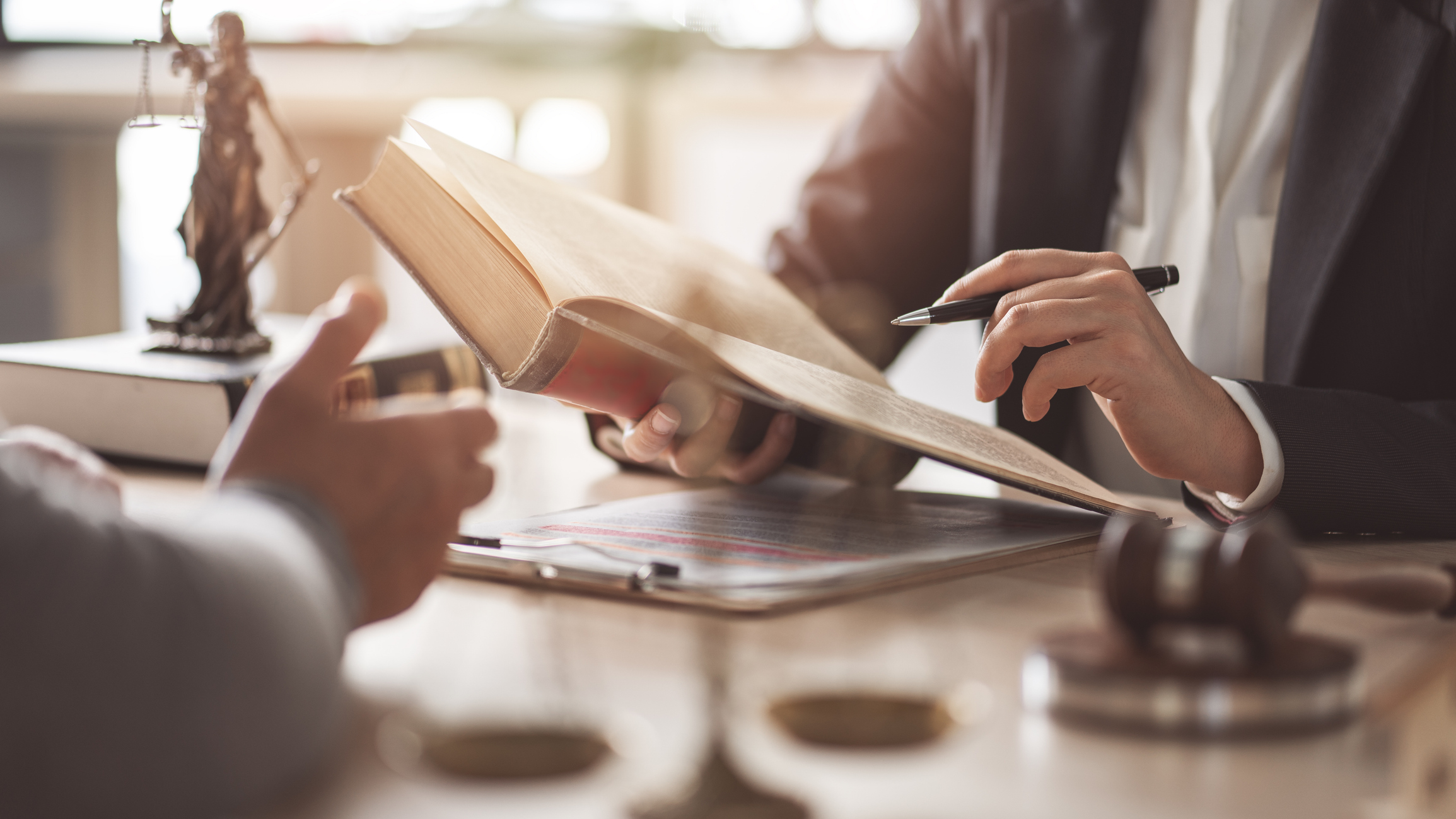 Florida criminal defense lawyer reviewing evidence and legal strategy with a client