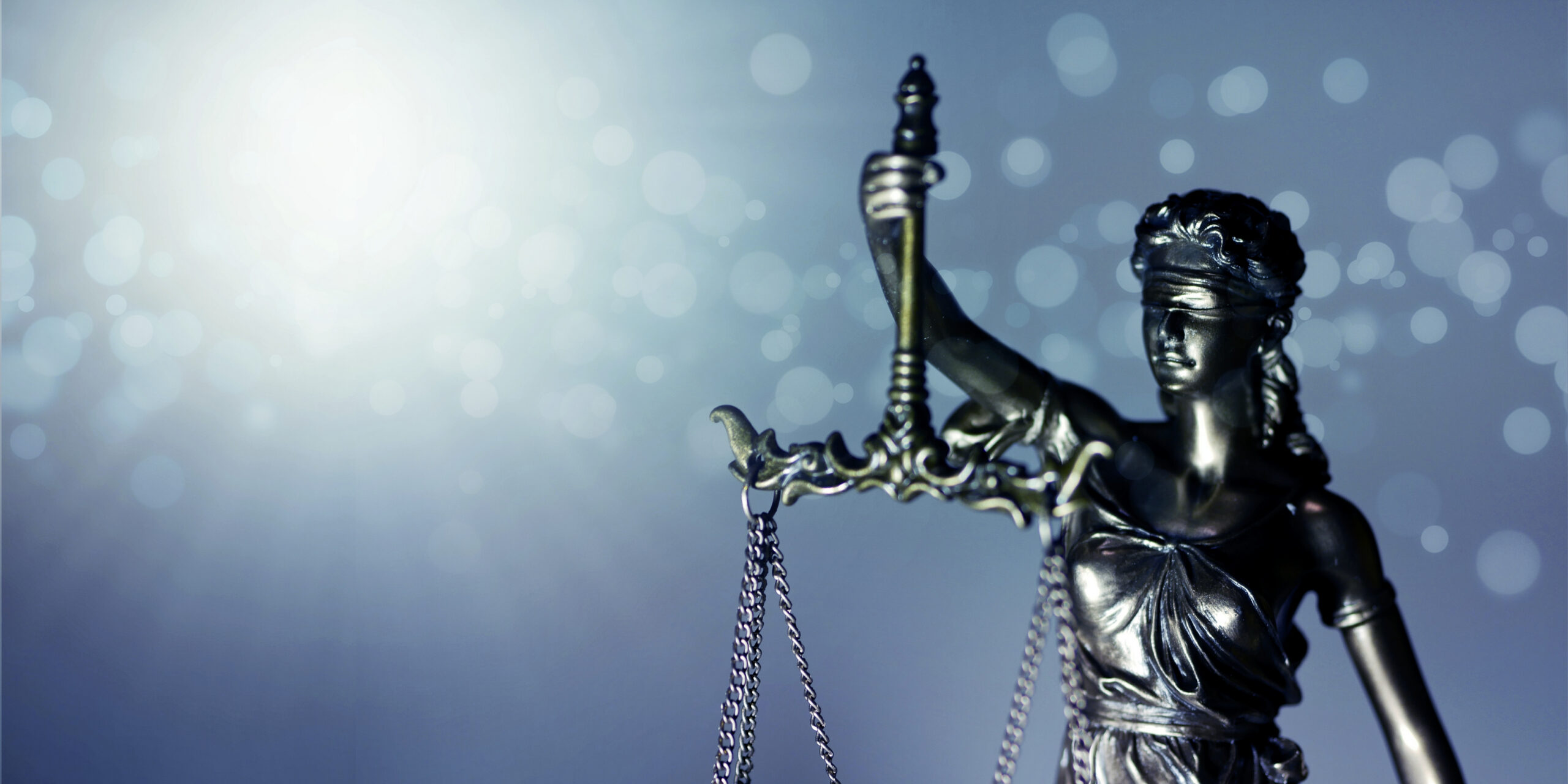 Lady Justice holding scales, illustrating sex crimes defense in Orlando